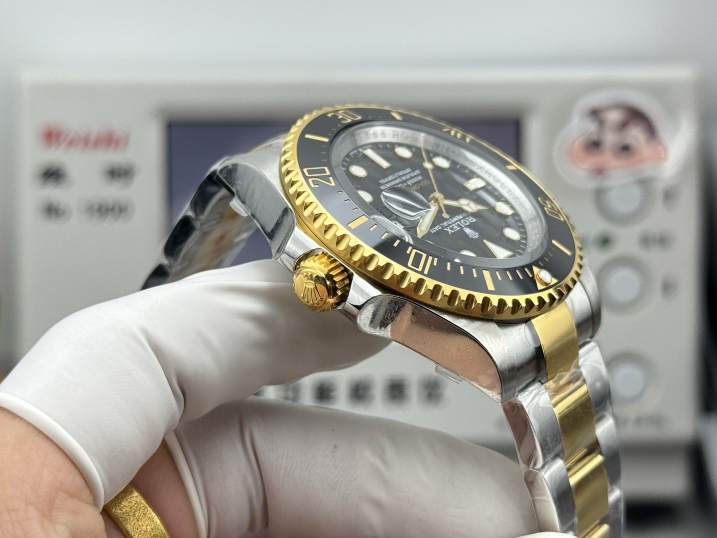 Side profile of replica Rolex Sea-Dweller showing bezel teeth and winding crown