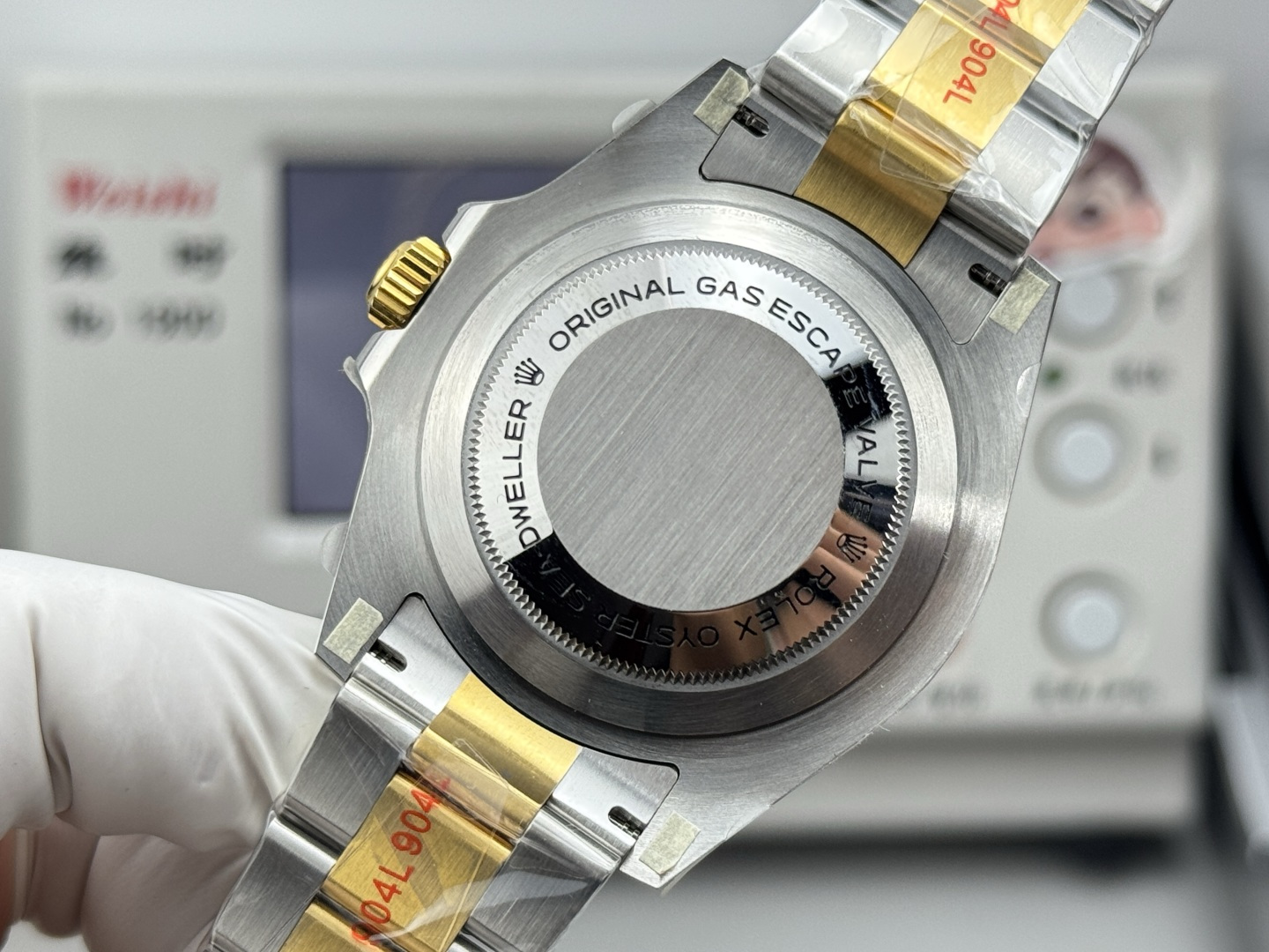 Caseback view of replica Rolex Sea-Dweller with gas escape valve and brushed finish